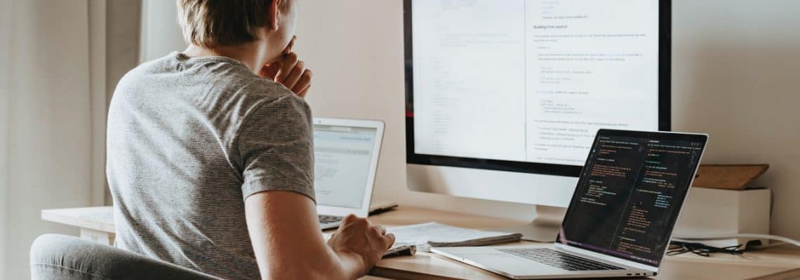 man looking at laptop